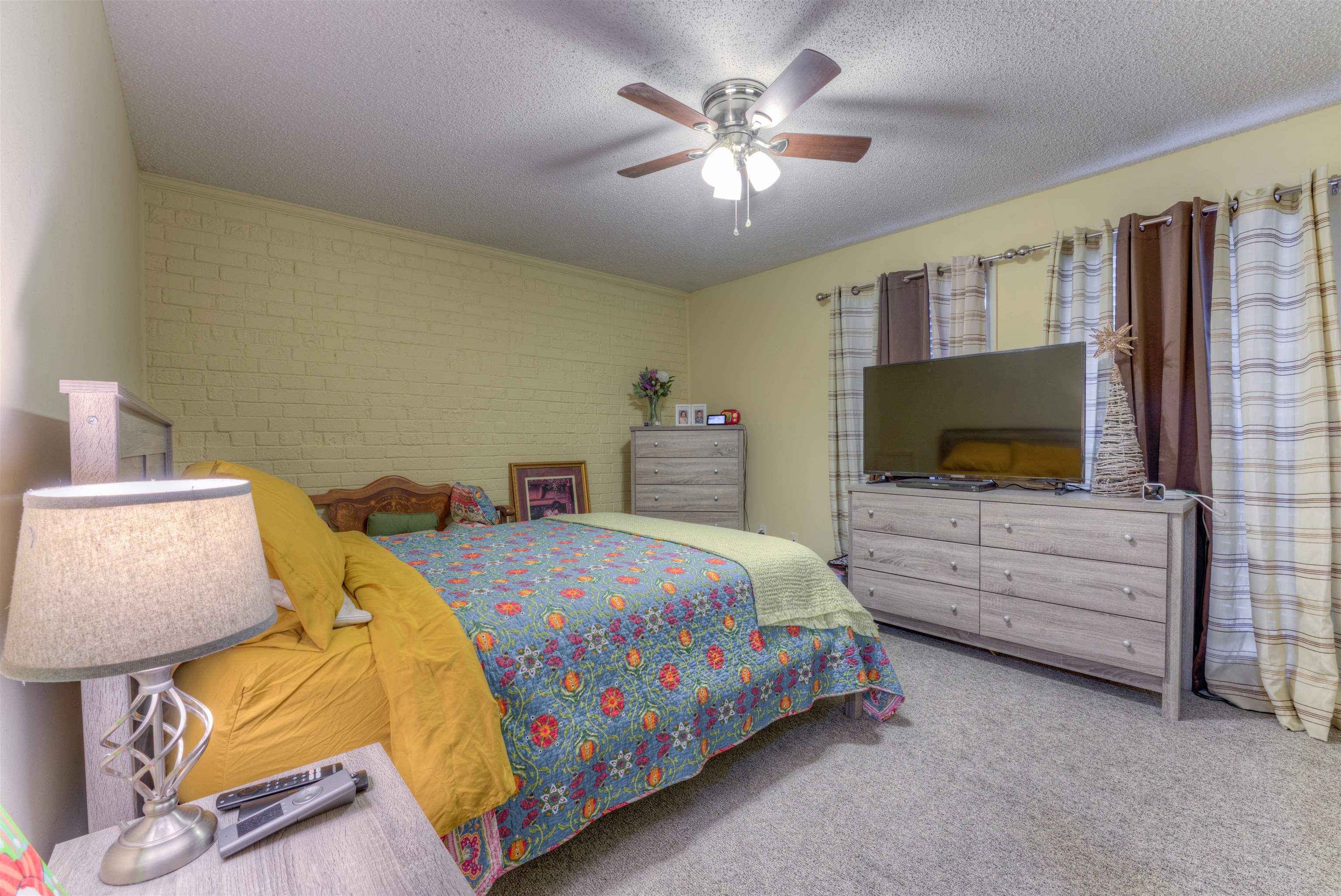 997 June Road Memphis, TN 38119 - Photo 12 of 30 a bedroom with a bed and a flat screen tv