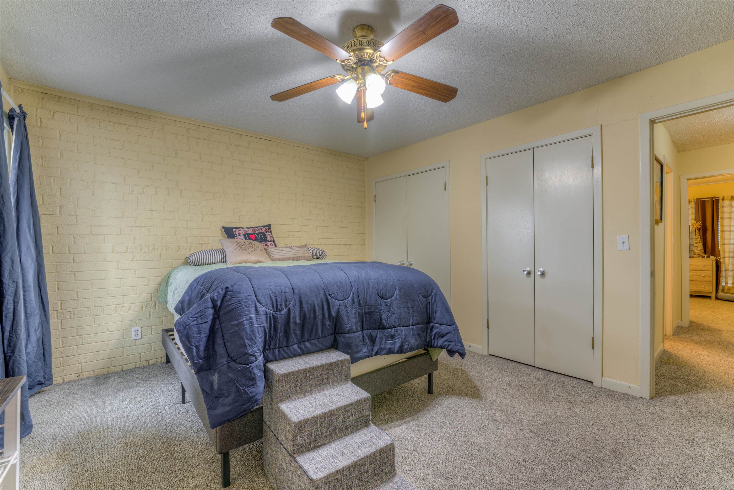 997 June Road Memphis, TN 38119 - Photo 17 of 30 a bedroom with a bed and a chandelier