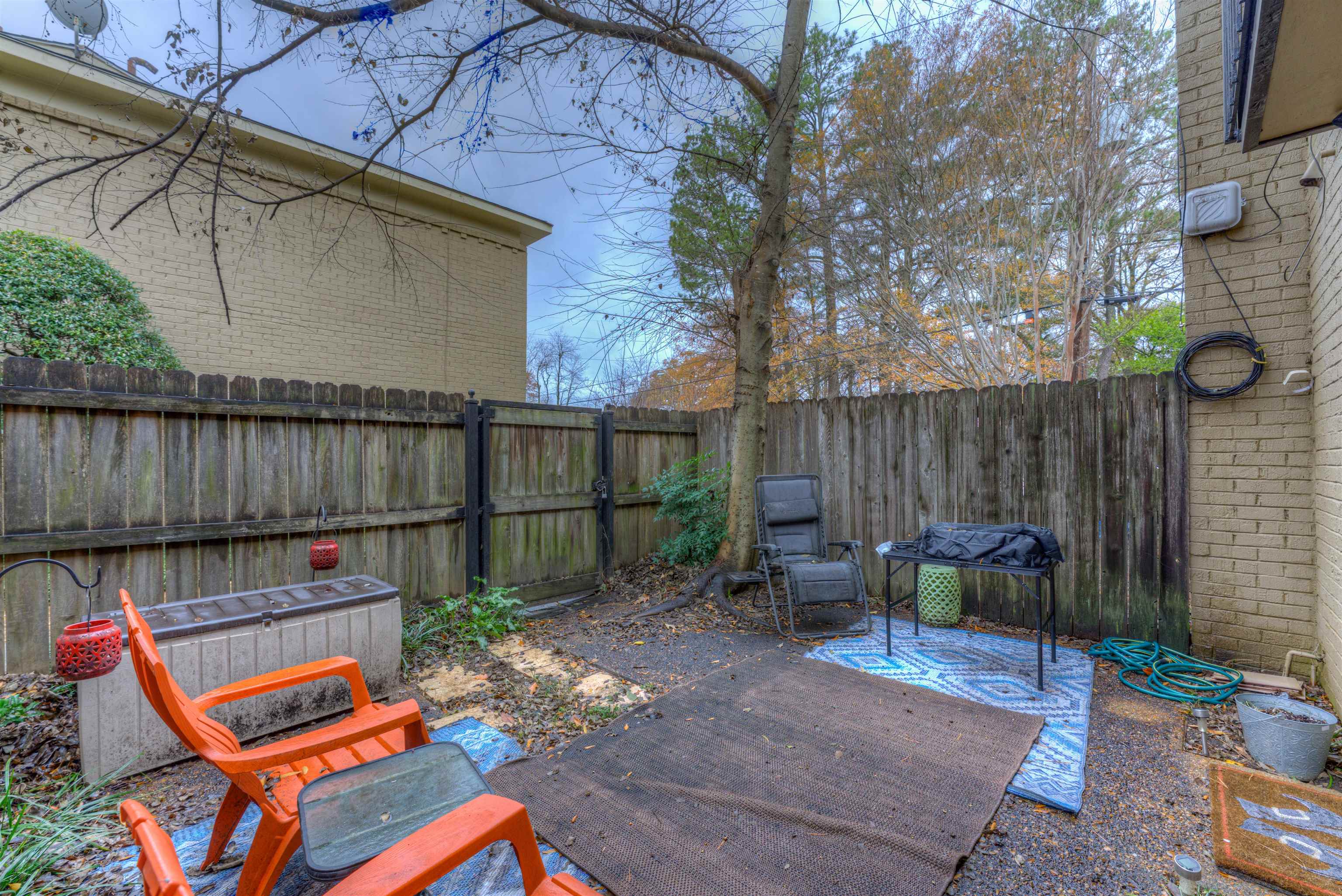 997 June Road Memphis, TN 38119 - Photo 20 of 30 a backyard of a house with outdoor seating