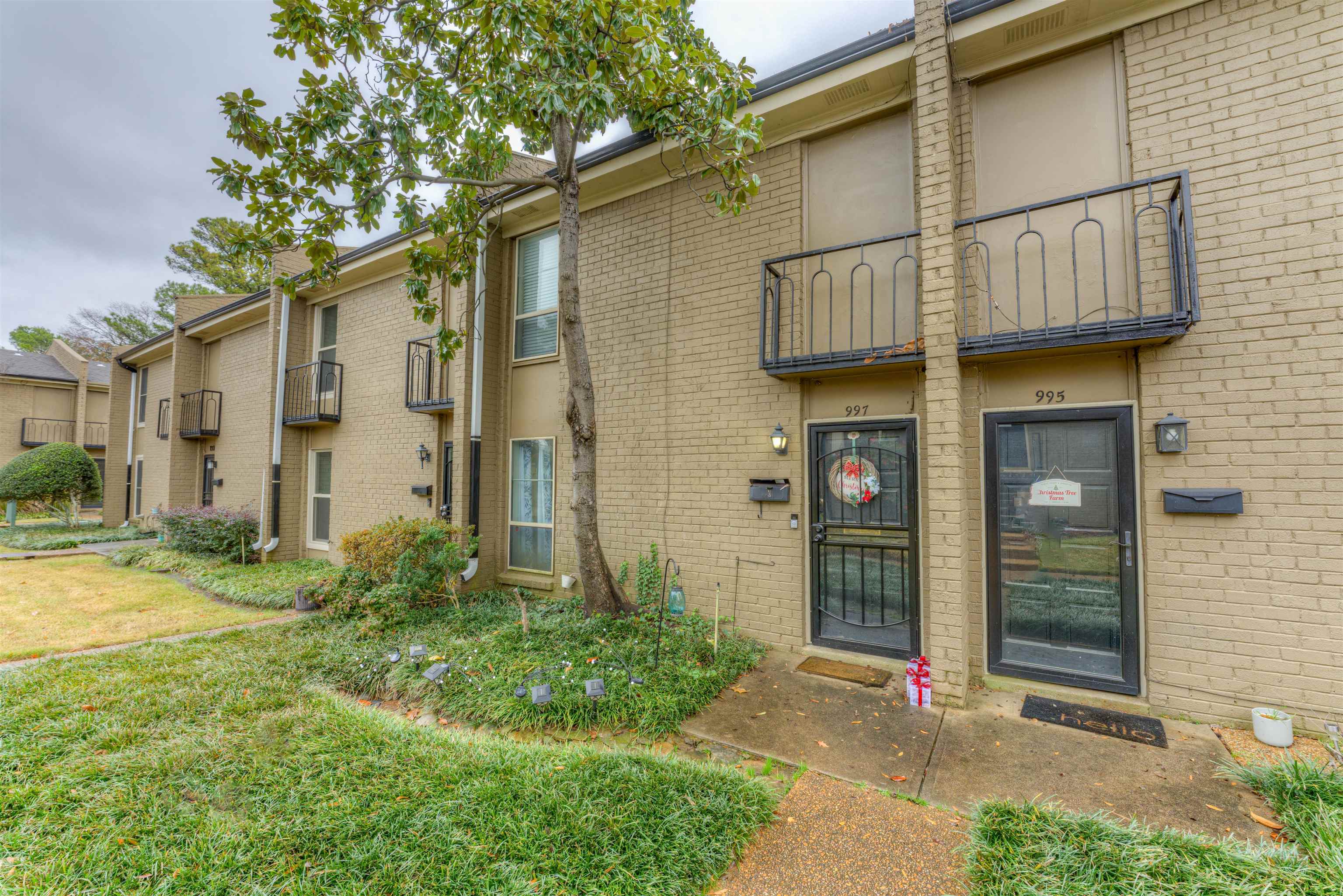 997 June Road Memphis, TN 38119 - Photo 2 of 30 a view of a house with a yard and plants
