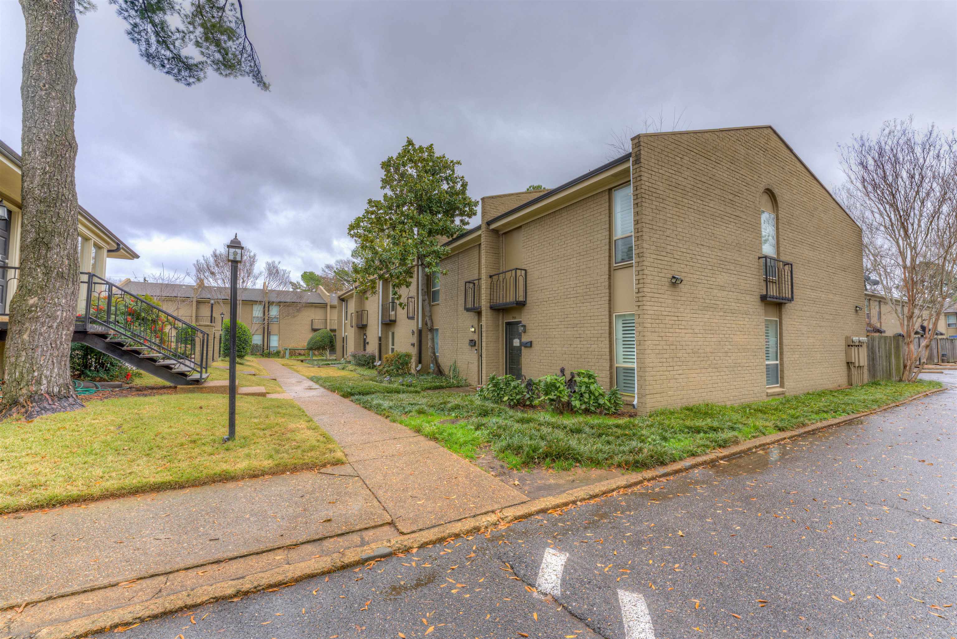 997 June Road Memphis, TN 38119 - Photo 21 of 30 a front view of a house with a yard and garage