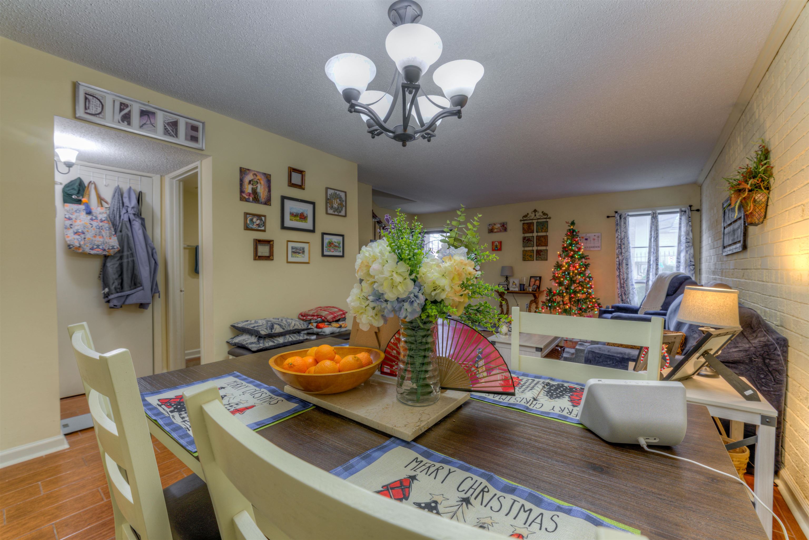 997 June Road Memphis, TN 38119 - Photo 6 of 30 a living room with furniture and a chandelier