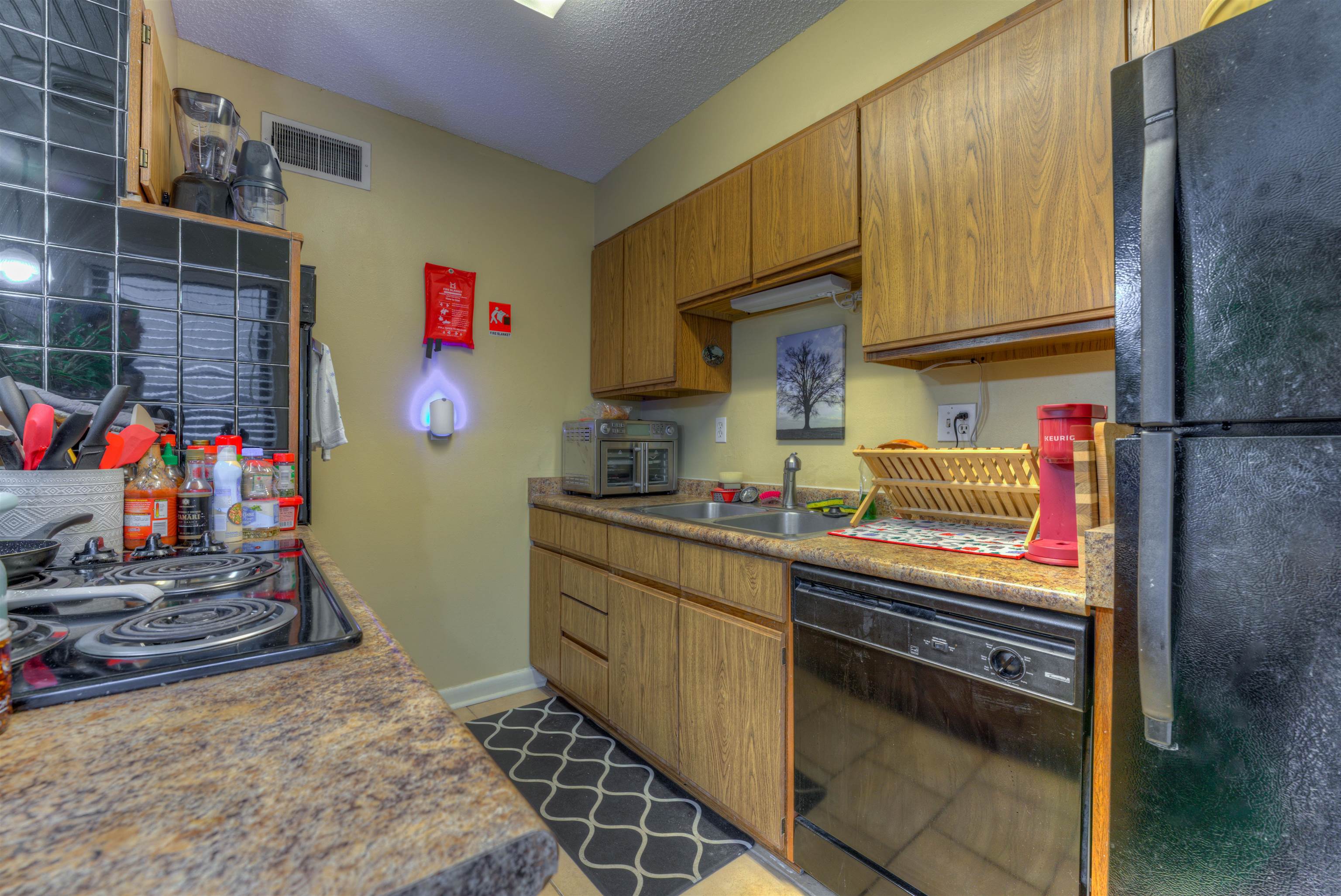 997 June Road Memphis, TN 38119 - Photo 8 of 30 a kitchen with stainless steel appliances granite countertop a sink stove and cabinets