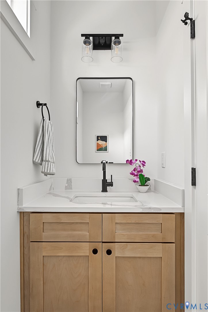 3601.5 Decatur Street Richmond, VA 23224 - Photo 16 of 32 Light wood-finish vanity with an integrated sink a