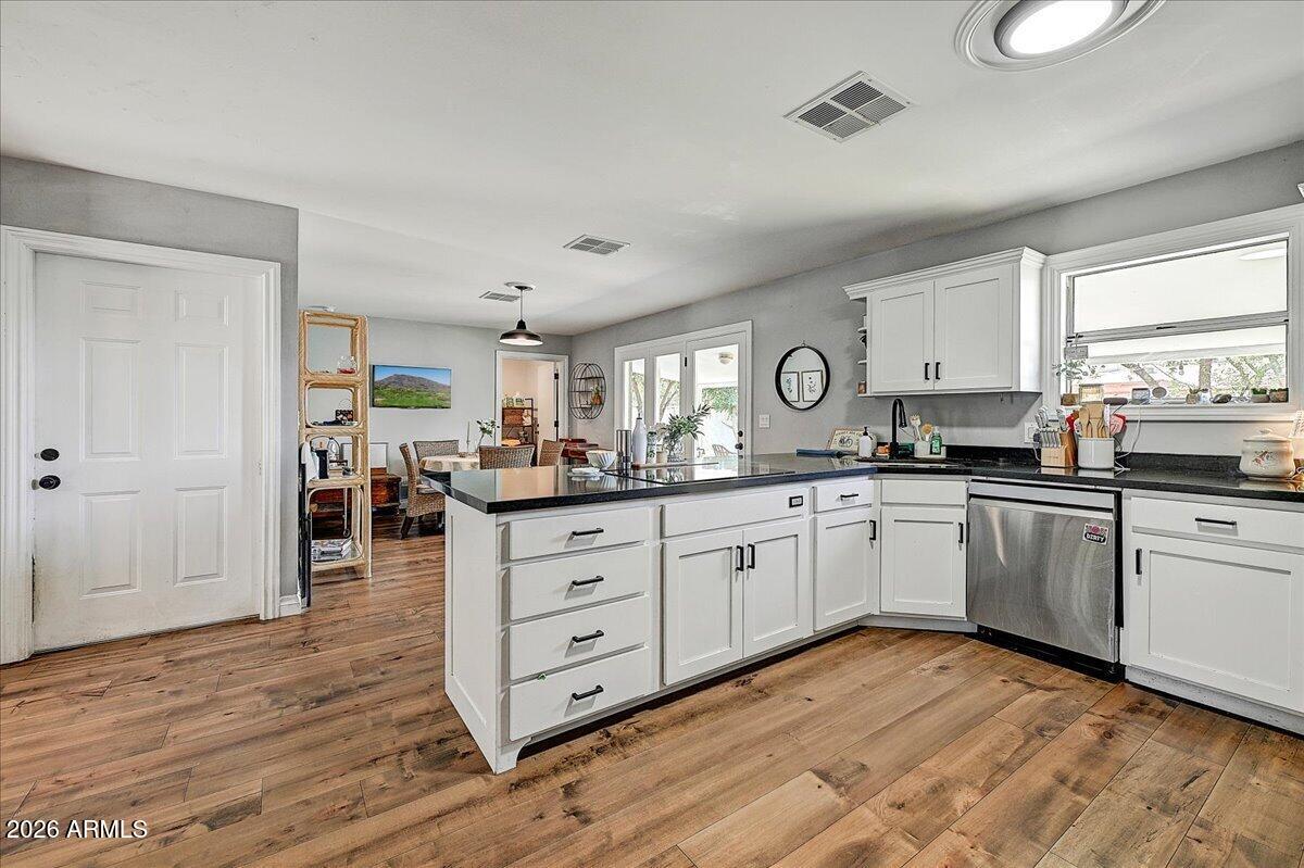 607 West 15th Street Tempe, AZ 85281 - Photo 8 of 29 a kitchen with granite countertop a stove a sink and a refrigerator