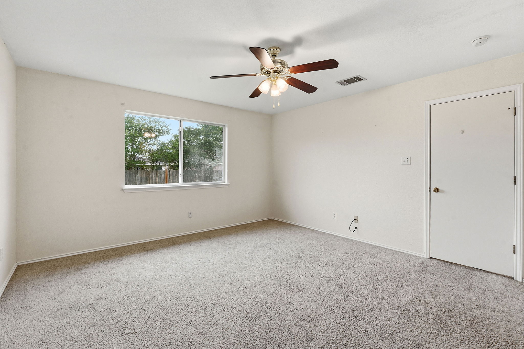 116 Blue Ridge Trail Elgin, TX 78621 - Photo 15 of 28 an empty room with windows and fan