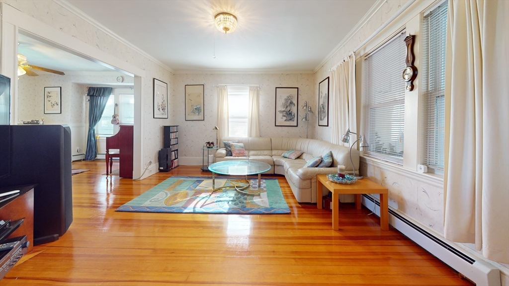 118 Colby Road Quincy, MA 02171 - Photo 12 of 40 a living room with furniture rug and a table