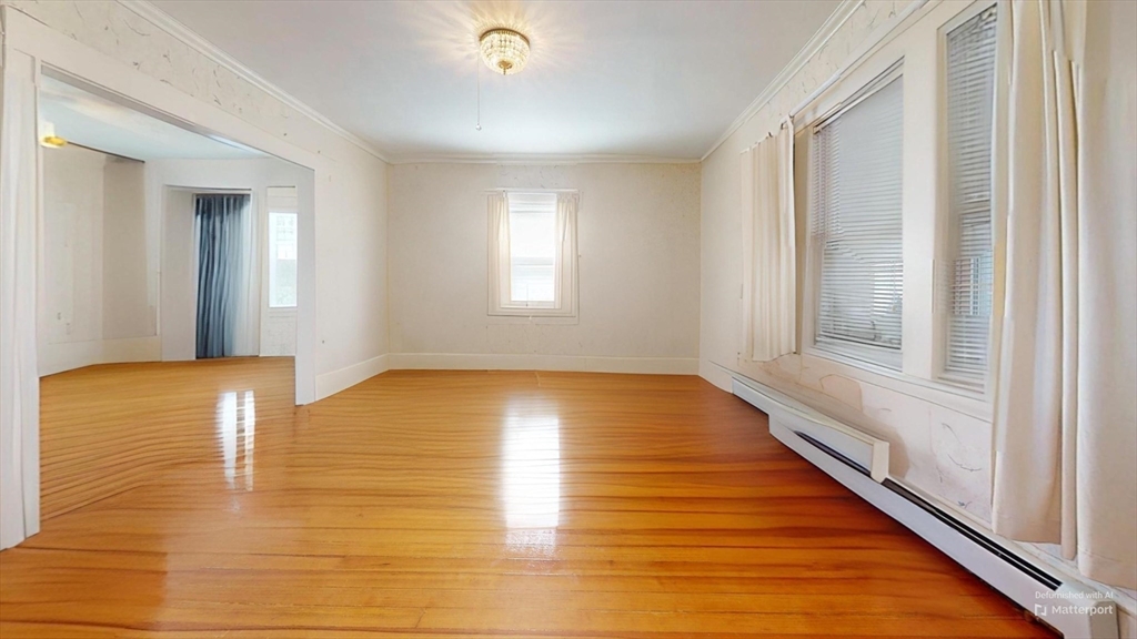 118 Colby Road Quincy, MA 02171 - Photo 20 of 40 a view of empty room with wooden floor and fan