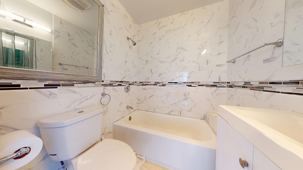 118 Colby Road Quincy, MA 02171 - Photo 23 of 40 a bathroom with a sink a toilet and bathtub