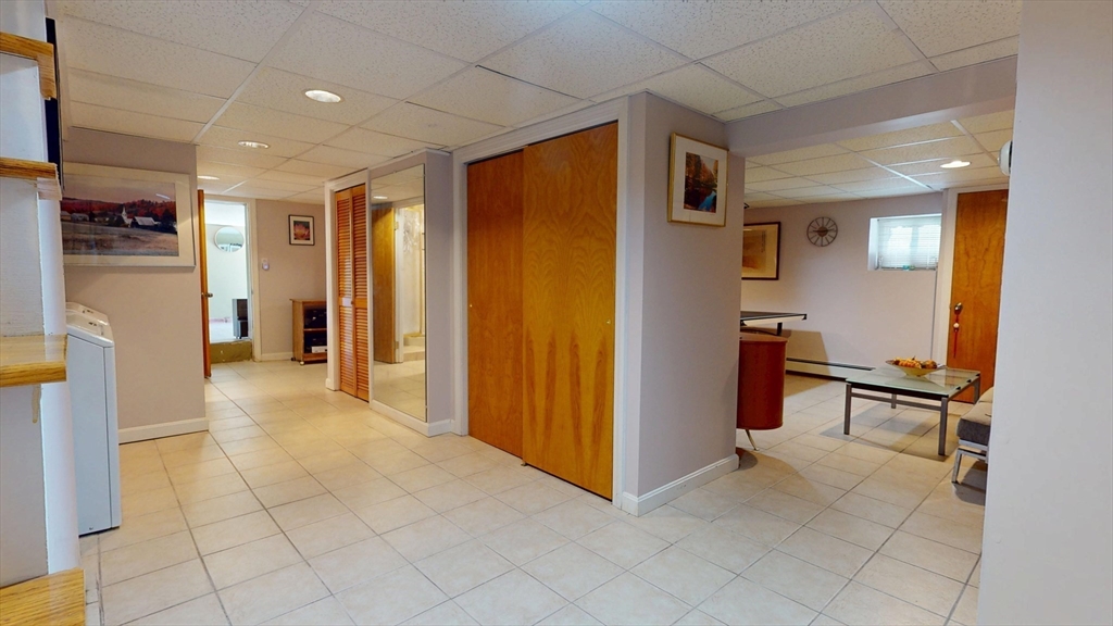 118 Colby Road Quincy, MA 02171 - Photo 33 of 40 a view of a hallway with furniture and refrigerator