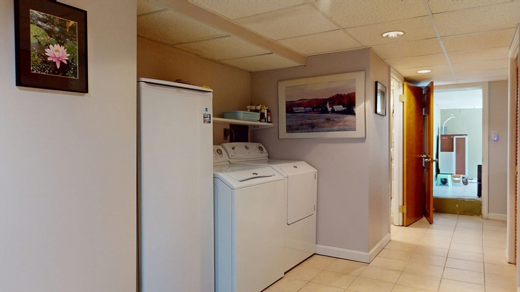 118 Colby Road Quincy, MA 02171 - Photo 37 of 40 a view of hallway with washer and dryer