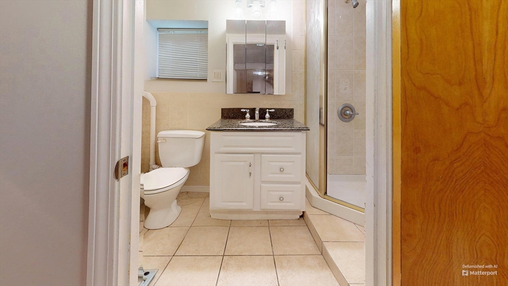 118 Colby Road Quincy, MA 02171 - Photo 40 of 40 a bathroom with a sink a toilet and shower