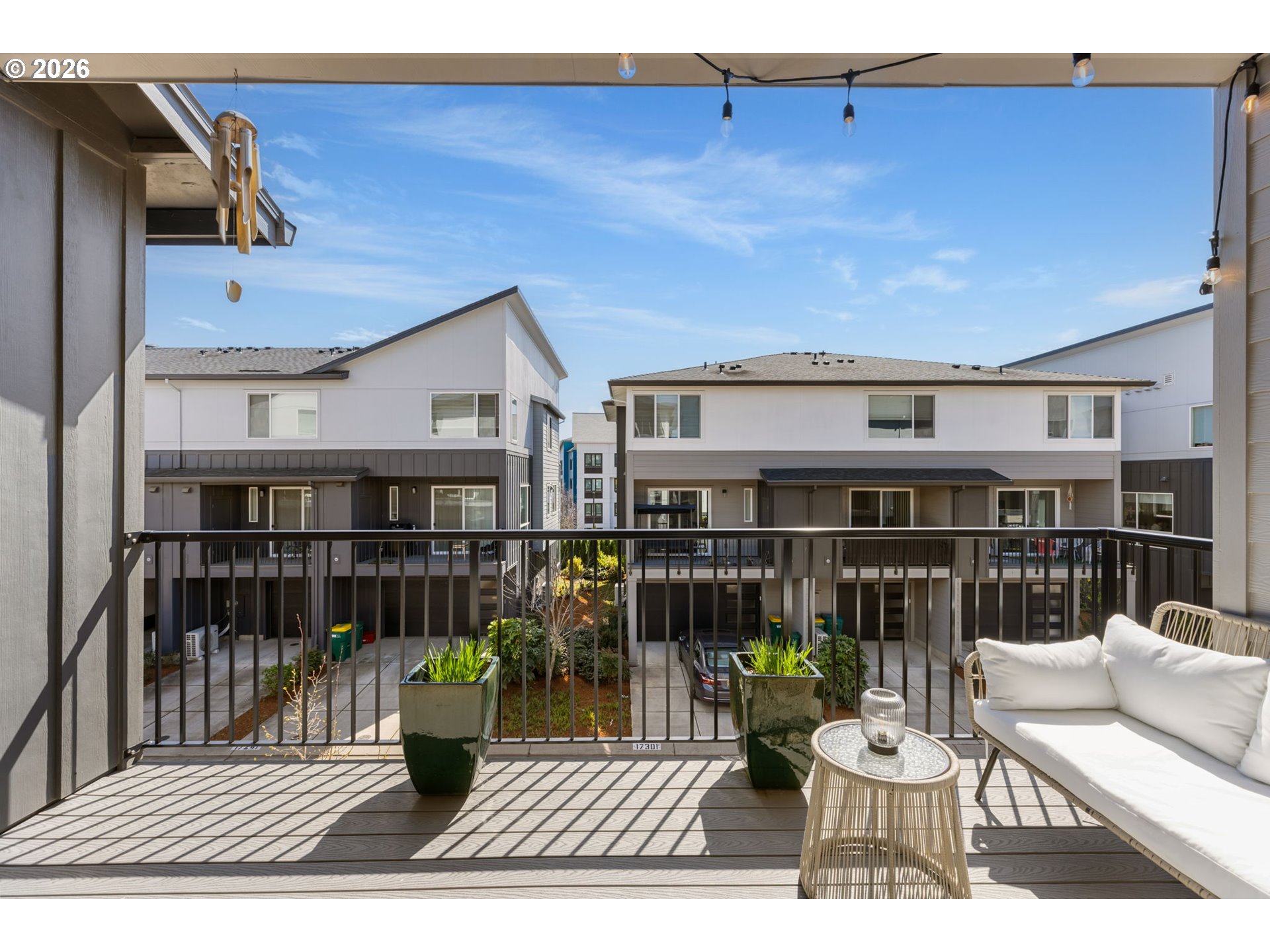 17312 Southwest Kite Lane Beaverton, OR 97007 - Photo 18 of 37 a view of a patio with couches chairs and wooden floor
