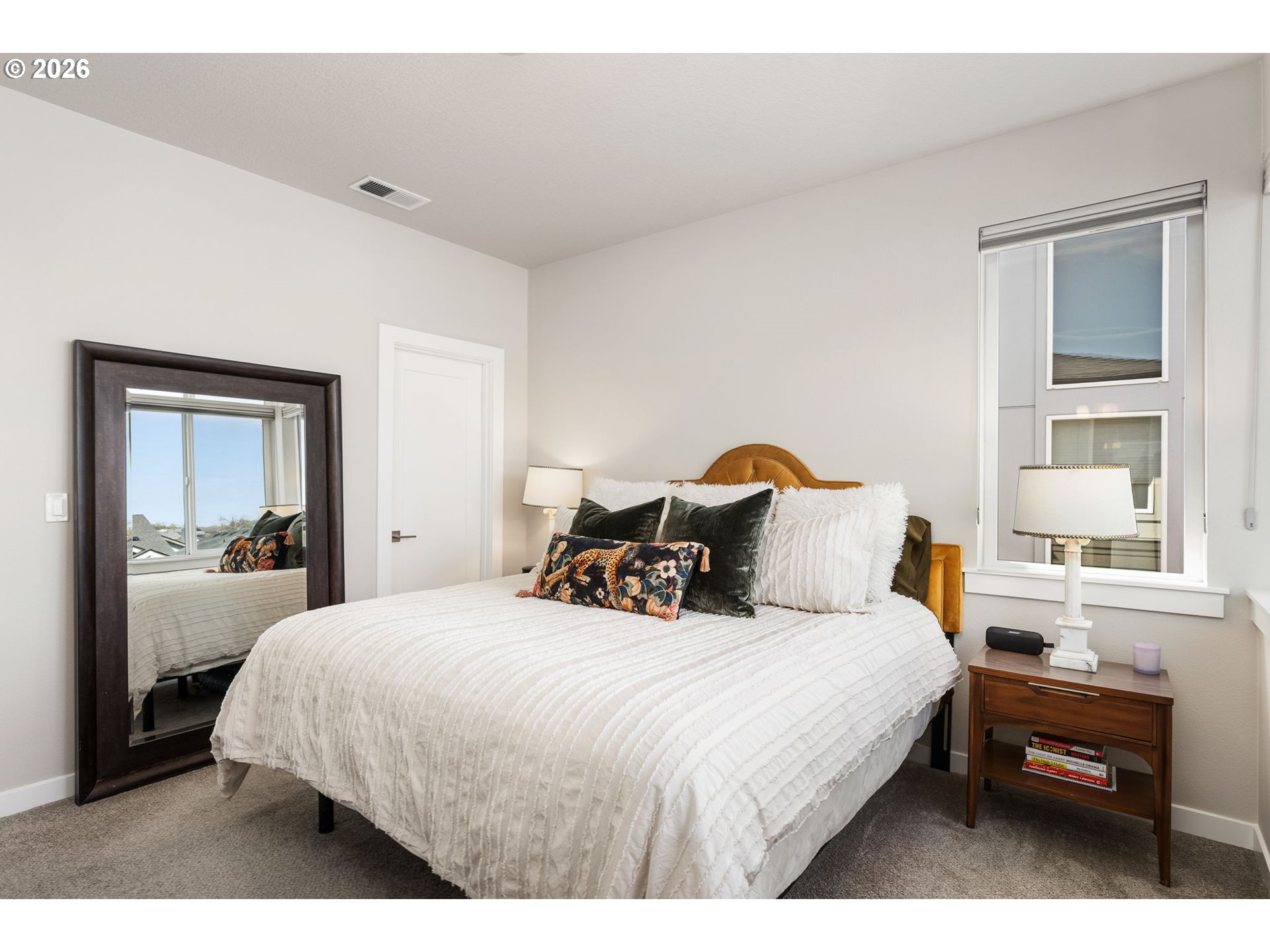 17312 Southwest Kite Lane Beaverton, OR 97007 - Photo 21 of 37 a bedroom with a bed a table and windows