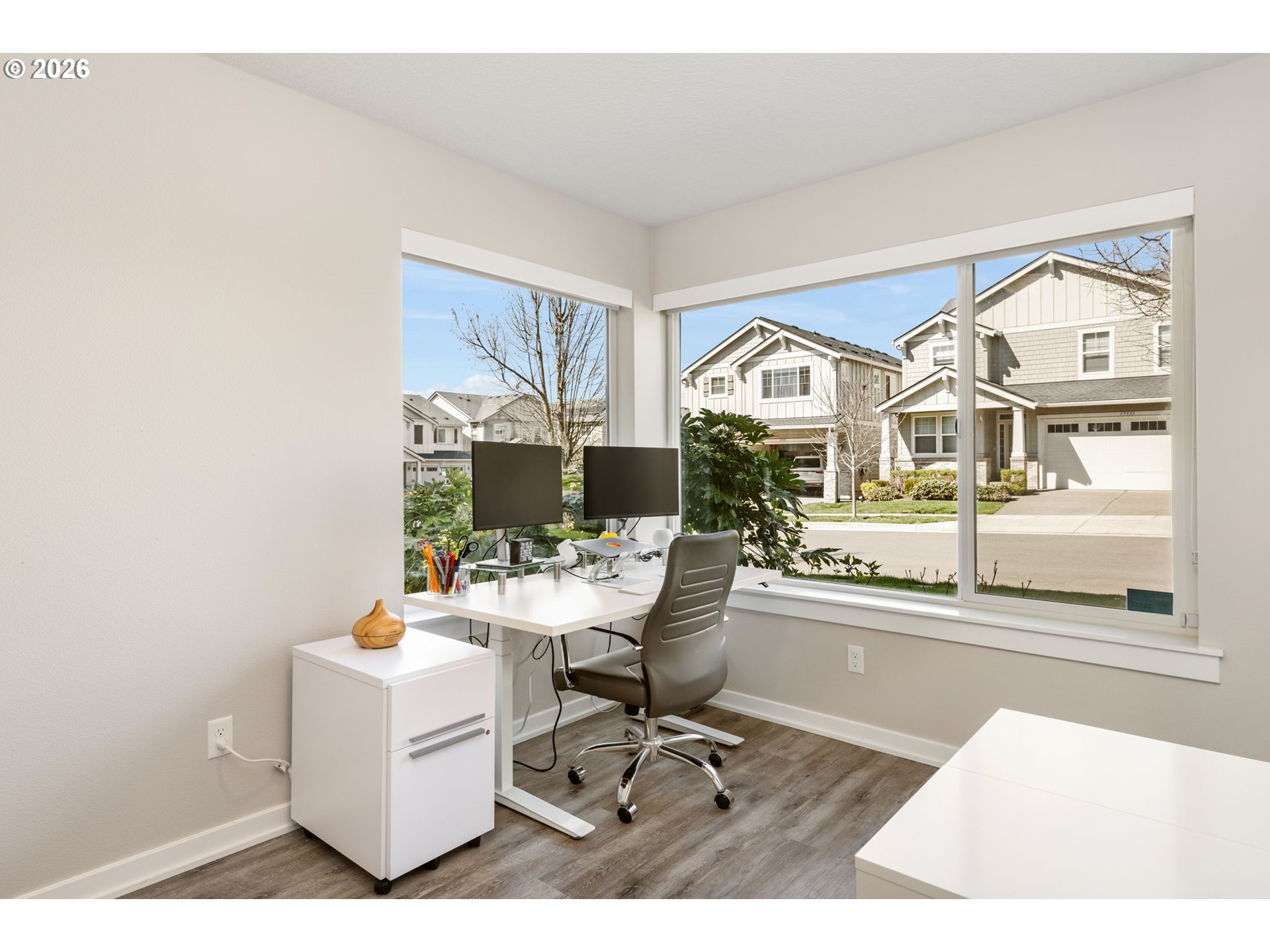 17312 Southwest Kite Lane Beaverton, OR 97007 - Photo 29 of 37 a living room with furniture a flat screen tv and a floor to ceiling window