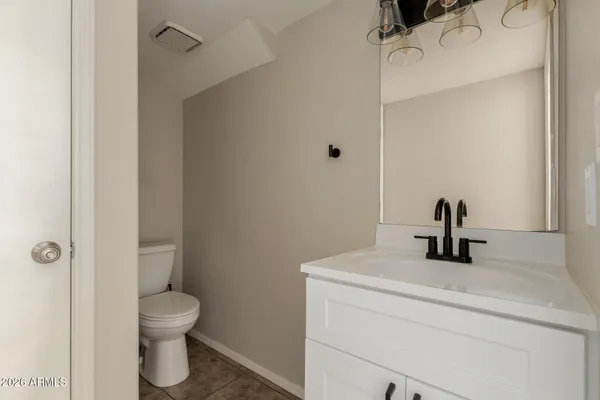 a kitchen with kitchen island a sink a stove and a refrigerator
