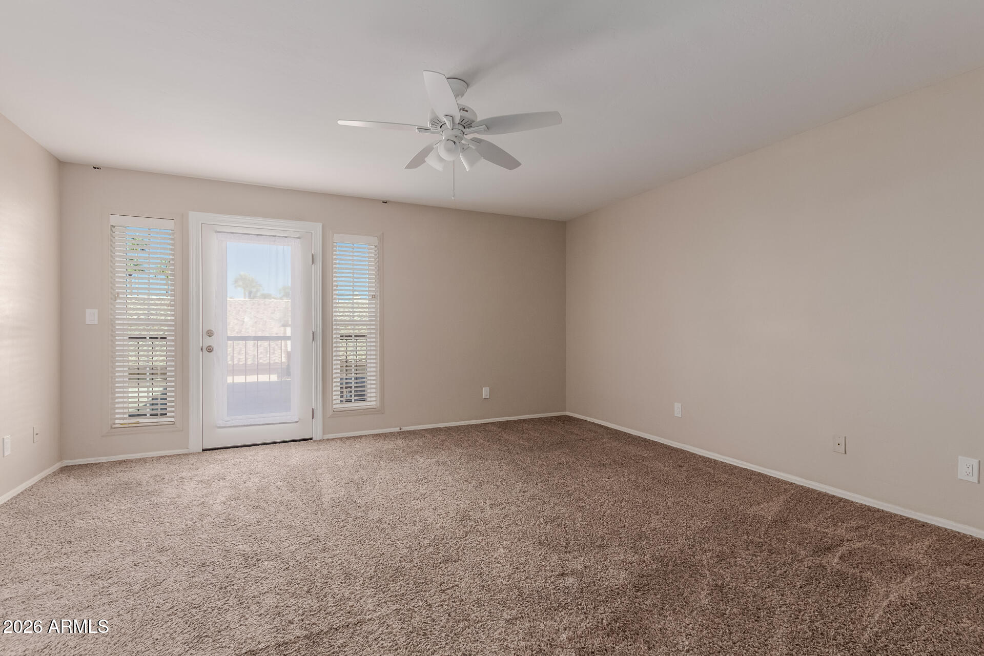 6223 North 12th Street, Unit 2 Phoenix, AZ 85014 - Photo 14 of 38 a view of an empty room with chandelier fan and fire place