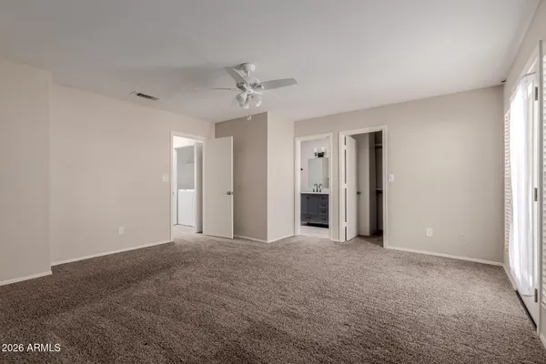 a bathroom with a toilet sink and a mirror