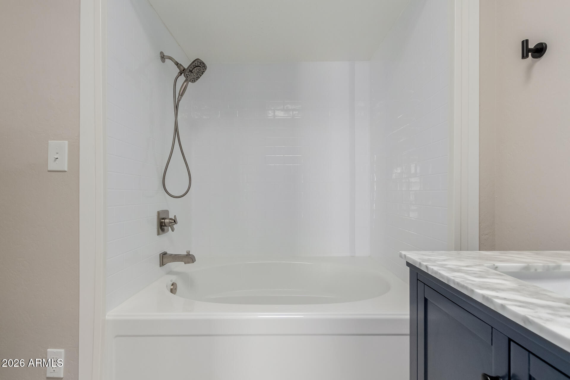 6223 North 12th Street, Unit 2 Phoenix, AZ 85014 - Photo 18 of 38 a bathroom with a bath tub with a shower