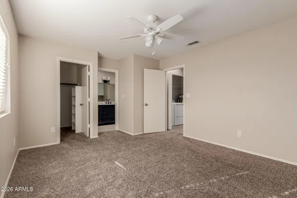 a bathroom with a bath tub with a shower