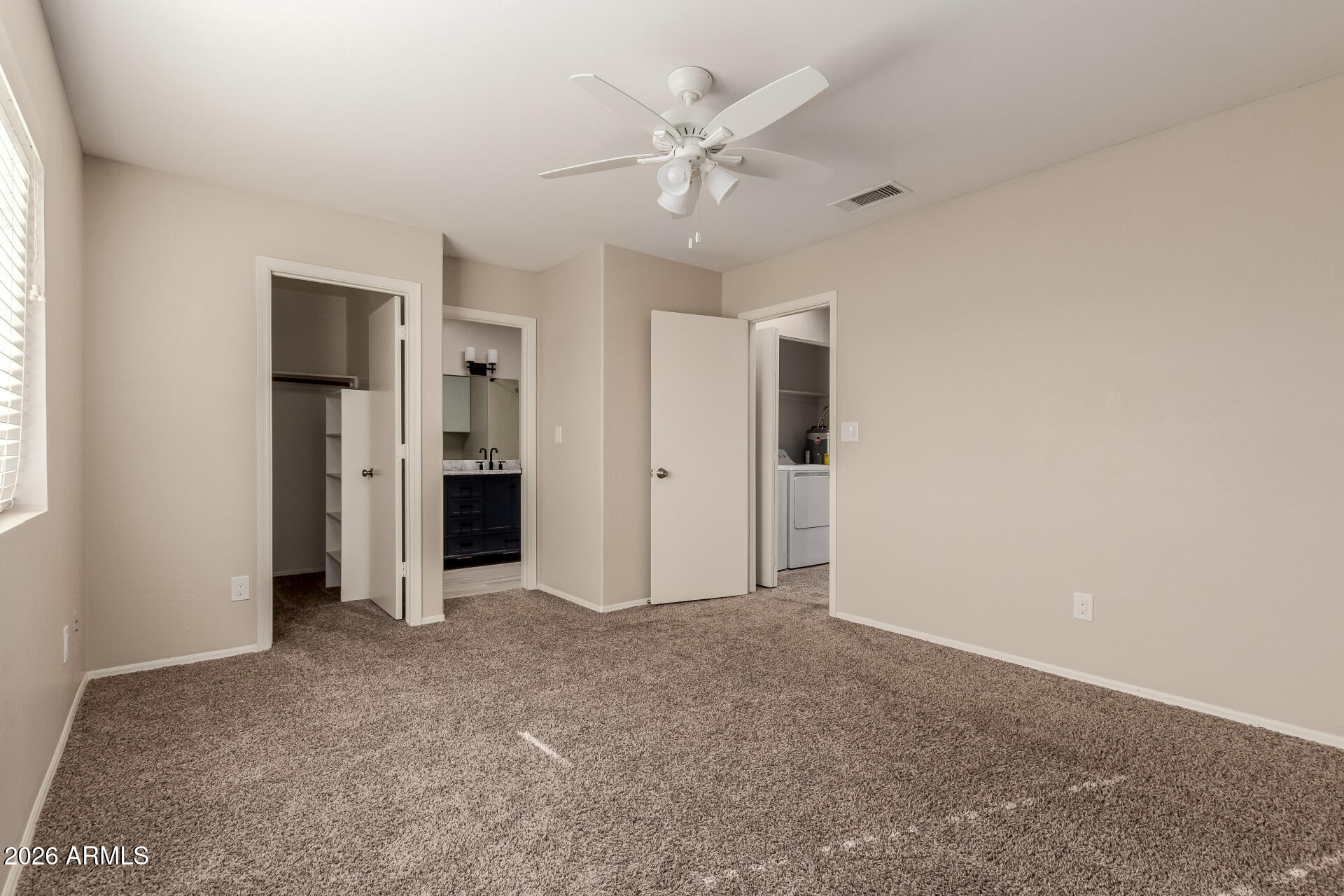 6223 North 12th Street, Unit 2 Phoenix, AZ 85014 - Photo 21 of 38 an empty room with closet and a ceiling fan