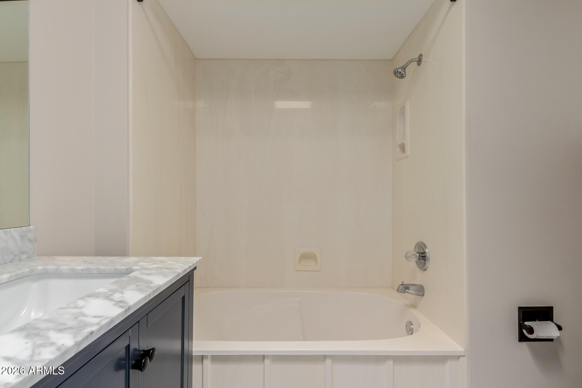 6223 North 12th Street, Unit 2 Phoenix, AZ 85014 - Photo 24 of 38 a bathroom with a granite countertop sink and a bathtub