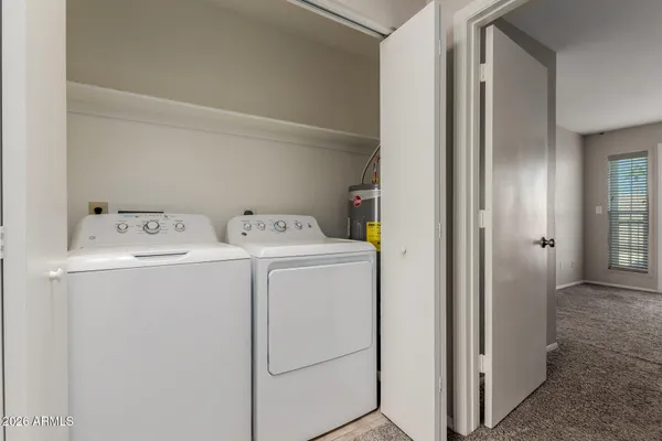 a bathroom with a granite countertop sink mirror bathtub and shower