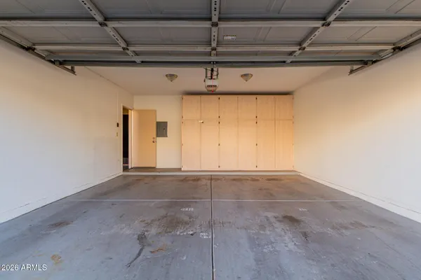 a bathroom with a granite countertop sink and a bathtub