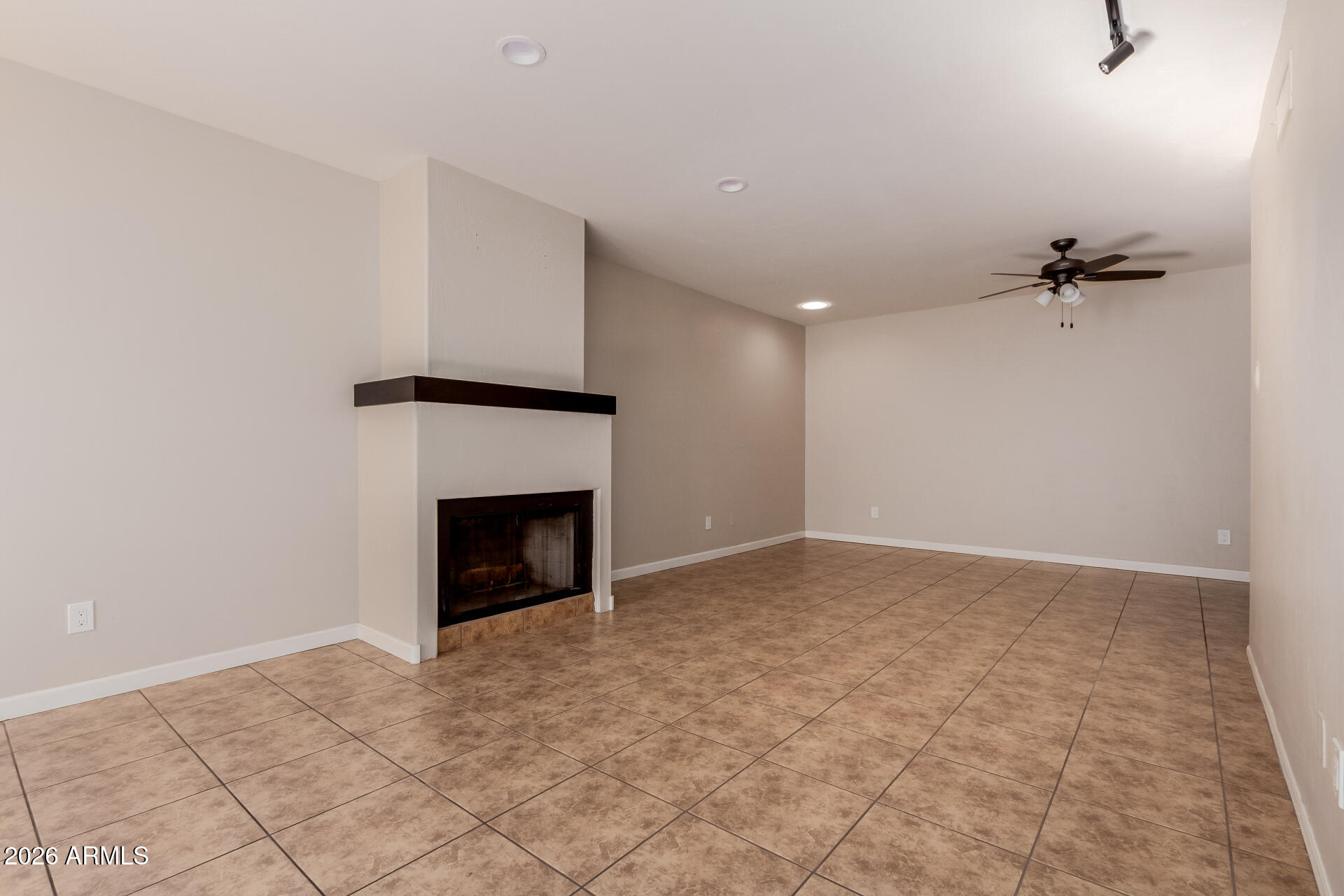 6223 North 12th Street, Unit 2 Phoenix, AZ 85014 - Photo 4 of 38 a view of an empty room with a fireplace