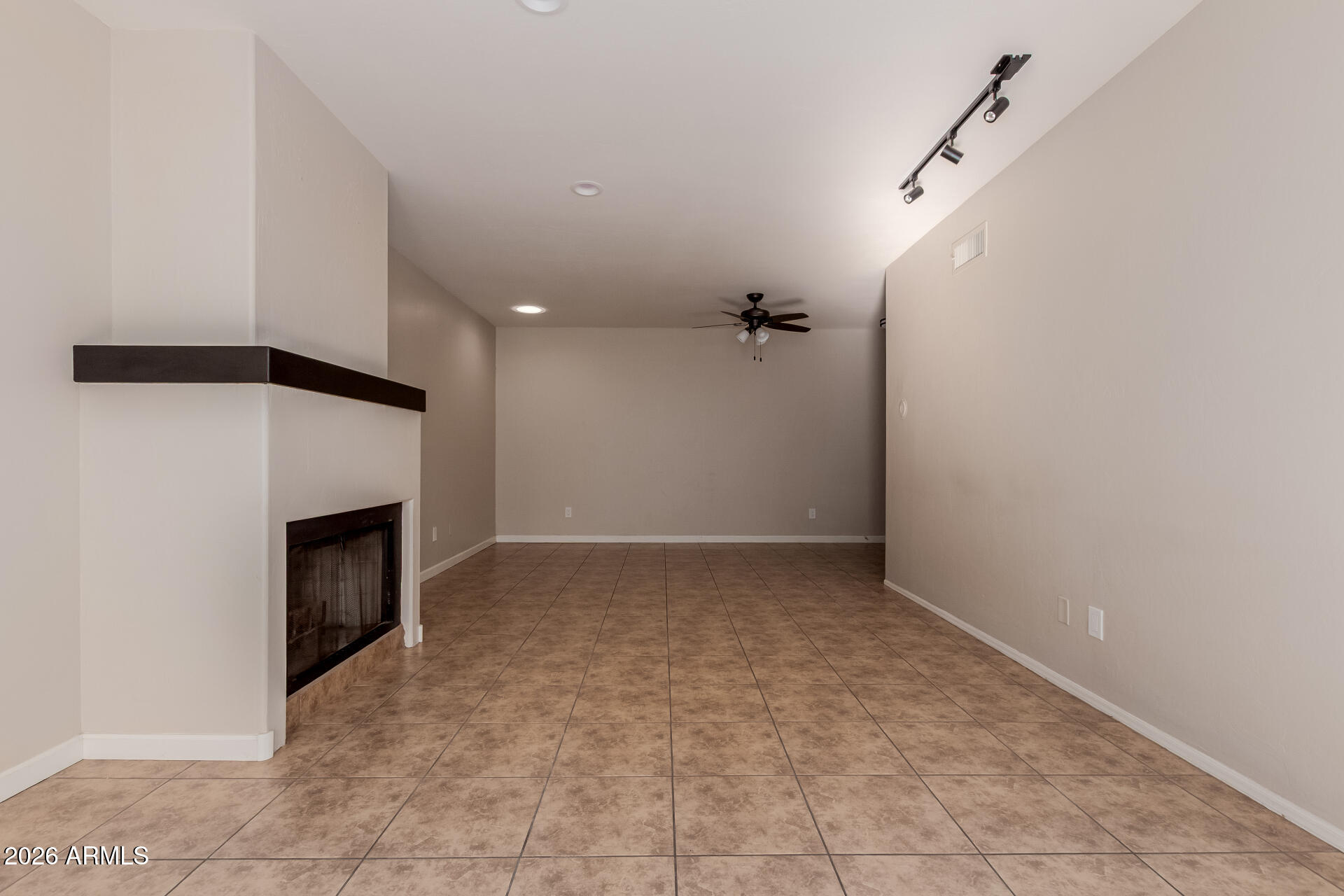 6223 North 12th Street, Unit 2 Phoenix, AZ 85014 - Photo 5 of 38 an empty room with a fireplace