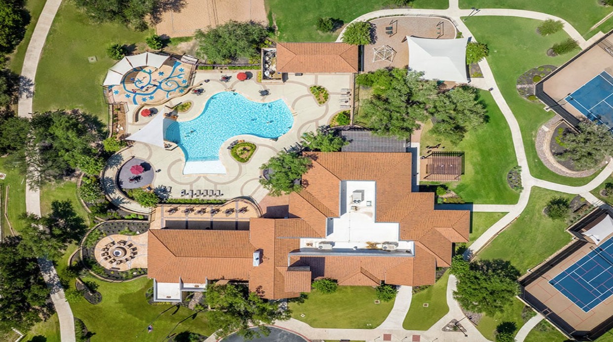 1217 Novara Trail Leander, TX 78641 - Photo 27 of 40 an aerial view of a house with a swimming pool outdoor seating and yard
