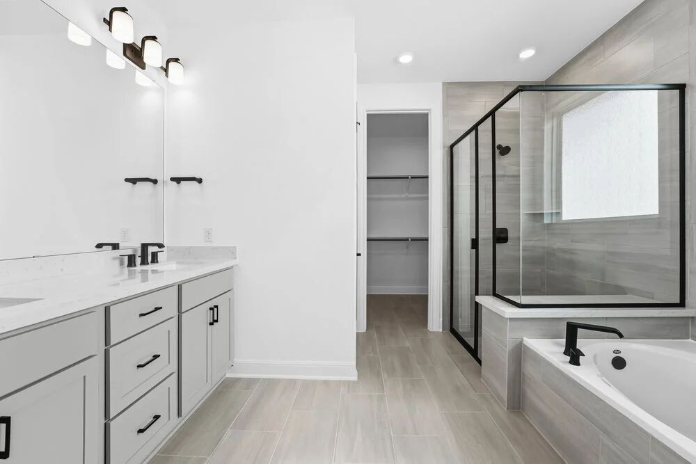 1217 Novara Trail Leander, TX 78641 - Photo 7 of 40 a bathroom with a tub a sink and mirror