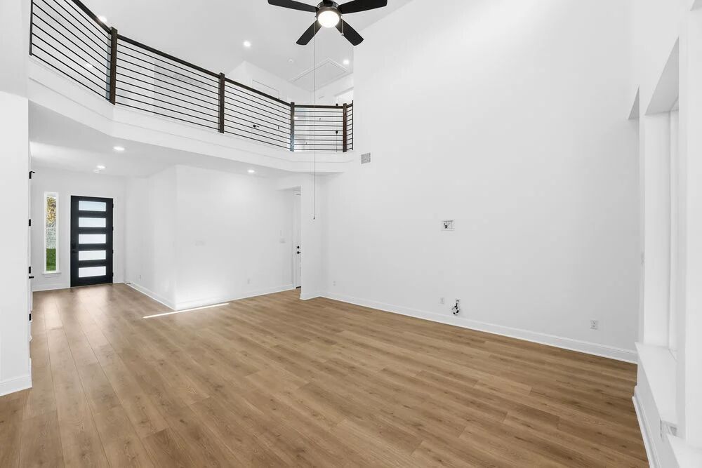 1217 Novara Trail Leander, TX 78641 - Photo 9 of 40 a view of an empty room with wooden floor