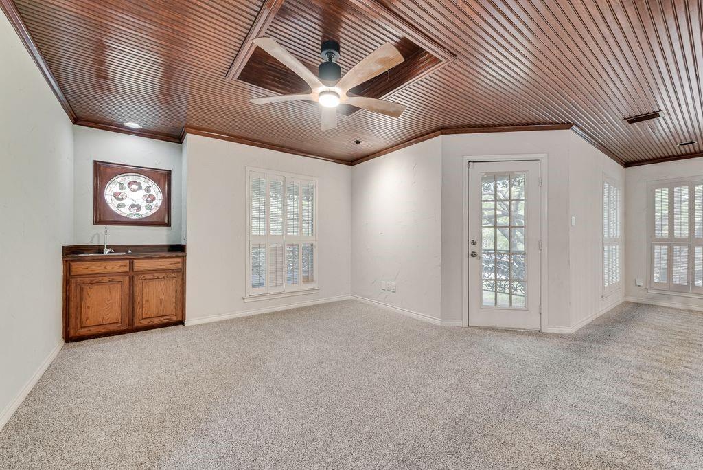 2 Eastshore Road Heath, TX 75032 - Photo 20 of 30 an empty room with windows and ceiling fan