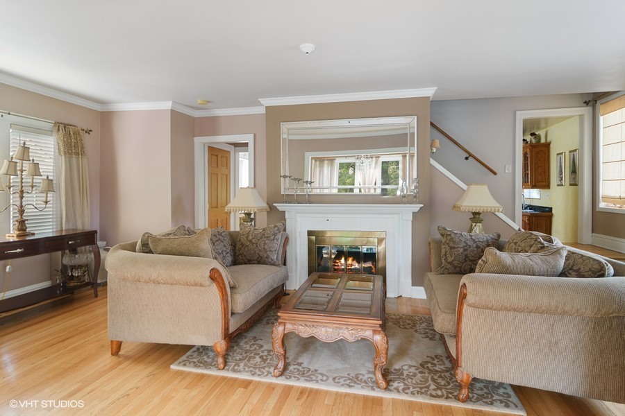 324 Blackhawk Road Riverside, IL 60546 - Photo 3 of 16 a living room with furniture and a fireplace