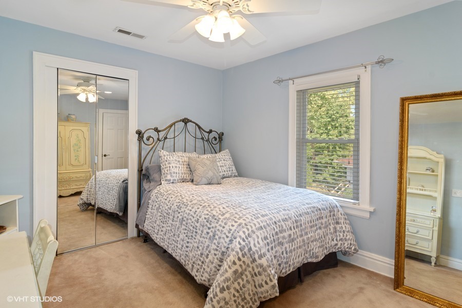 324 Blackhawk Road Riverside, IL 60546 - Photo 8 of 16 a bedroom with bed and a window