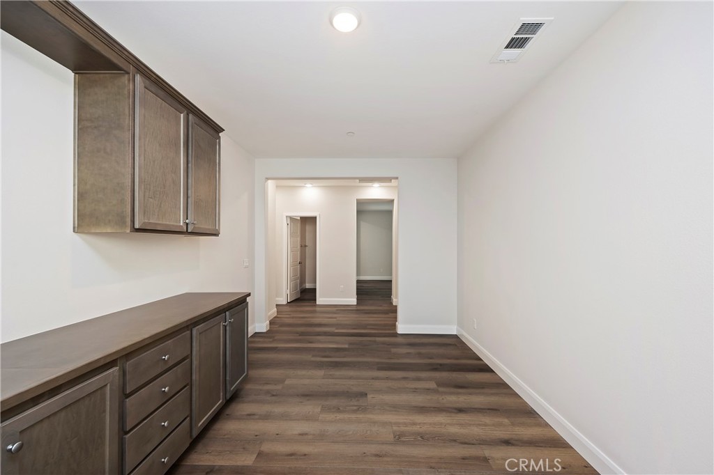 34709 Candlestick Circle Murrieta, CA 92563 - Photo 19 of 40 a view of a hallway with wooden floor