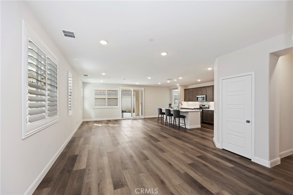 34709 Candlestick Circle Murrieta, CA 92563 - Photo 10 of 40 a view of empty room with kitchen and window