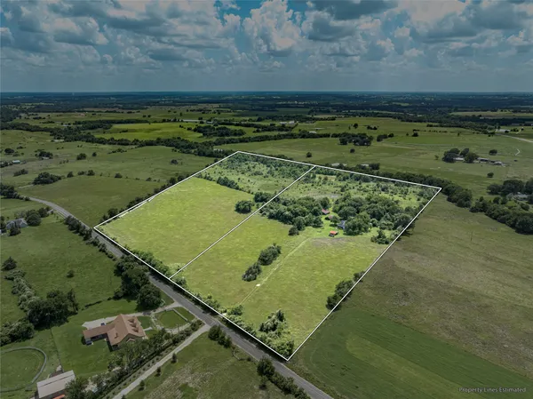 a view of a field with an ocean