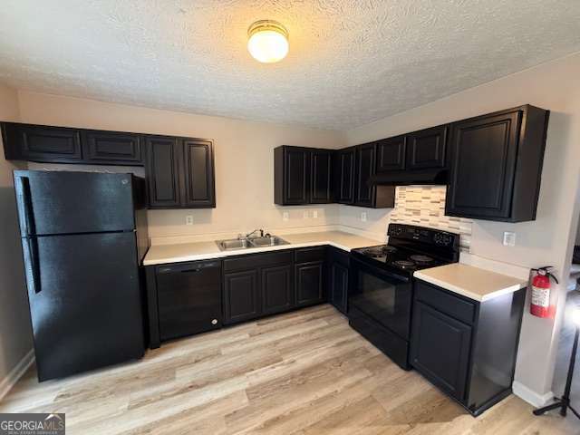 a kitchen with stainless steel appliances granite countertop a refrigerator a stove a sink and a microwave