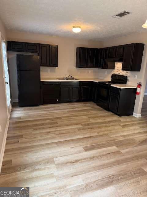 150 Blake Avenue Jackson, GA 30233 - Photo 12 of 12 a kitchen with stainless steel appliances kitchen island sink and refrigerator