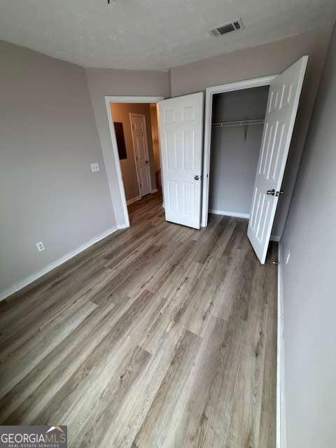 150 Blake Avenue Jackson, GA 30233 - Photo 3 of 12 a view of a hallway with wooden floor