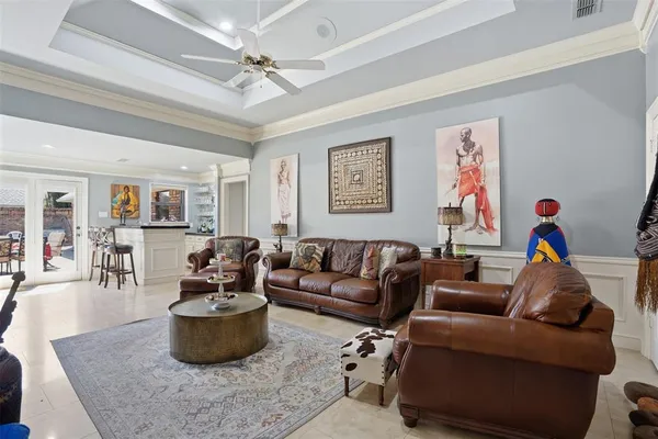 a living room with furniture a couch and wooden floor