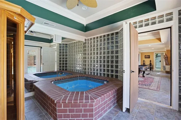 a view of a balcony with a table and chairs