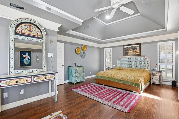 a bedroom with a bed and a dresser