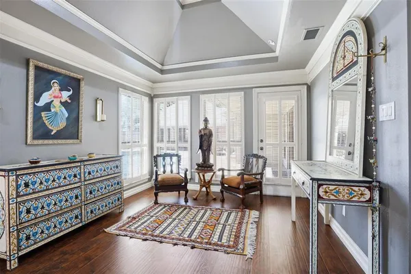a living room with furniture stairs and a window