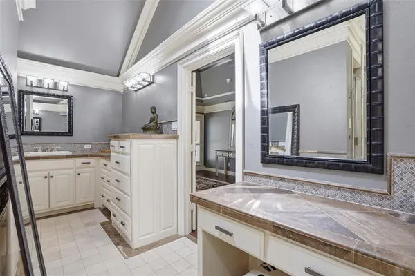 a utility room with cabinets washer and dryer