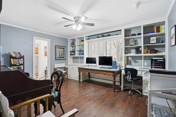 a view of a workspace with furniture and a lounge chair