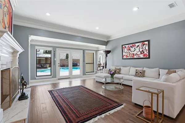a living room with furniture rug and a window