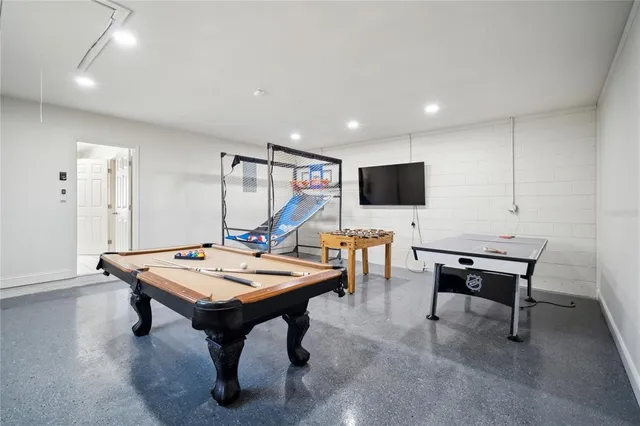 a view of a swimming pool with seating space